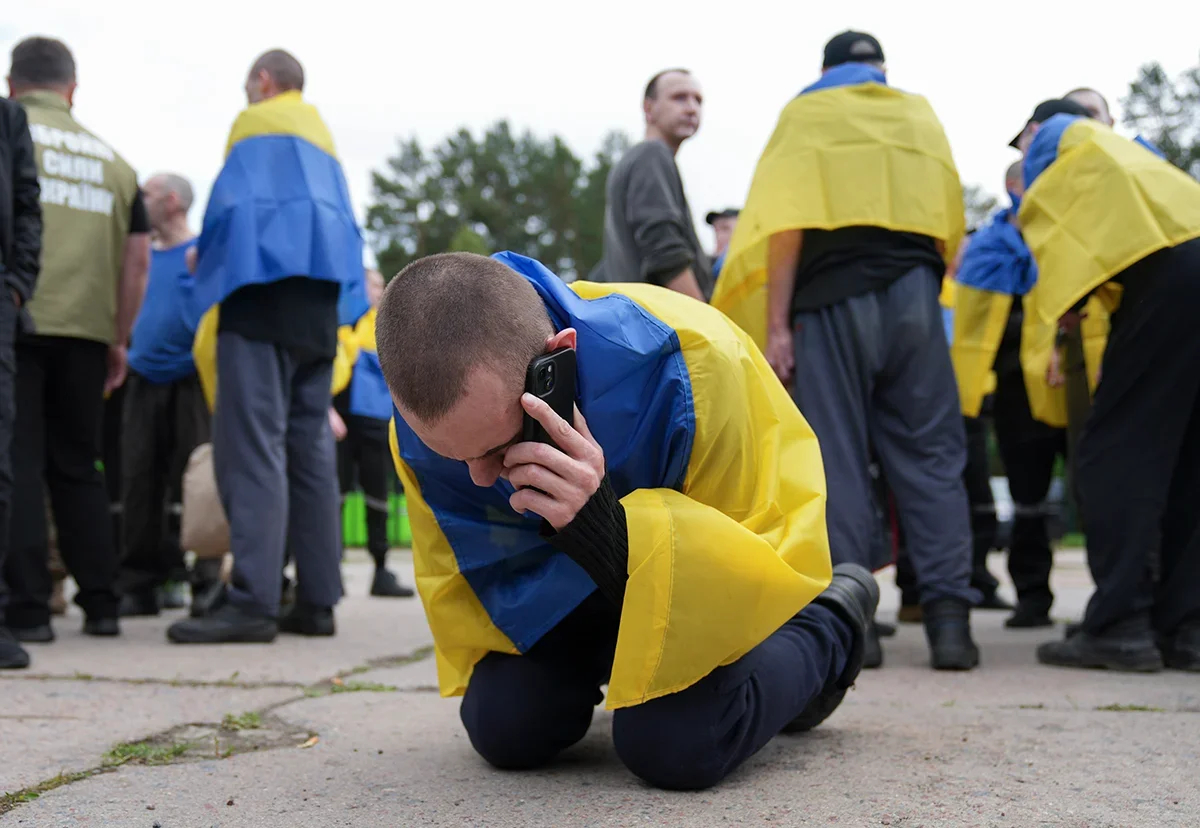 A Ukrainian former POW celebrates being back on home soil, 12 June 2025. Photo: EPA