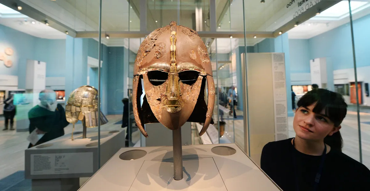 The Sutton Hoo helmet on display at the British Museum in London, 25 March 2014. Discovered in Suffolk in 1939, the magnificent golden helmet was buried with a 7th-century Anglo-Saxon king. Photo: EPA / Andy Rain