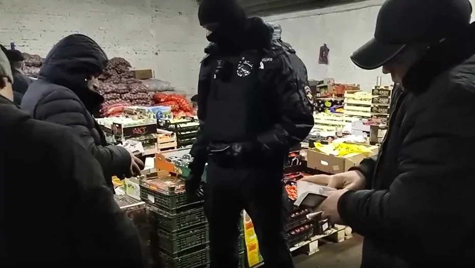 Authorities raiding a St. Petersburg vegetable warehouse last month. Photo: Russia’s Interior Ministry