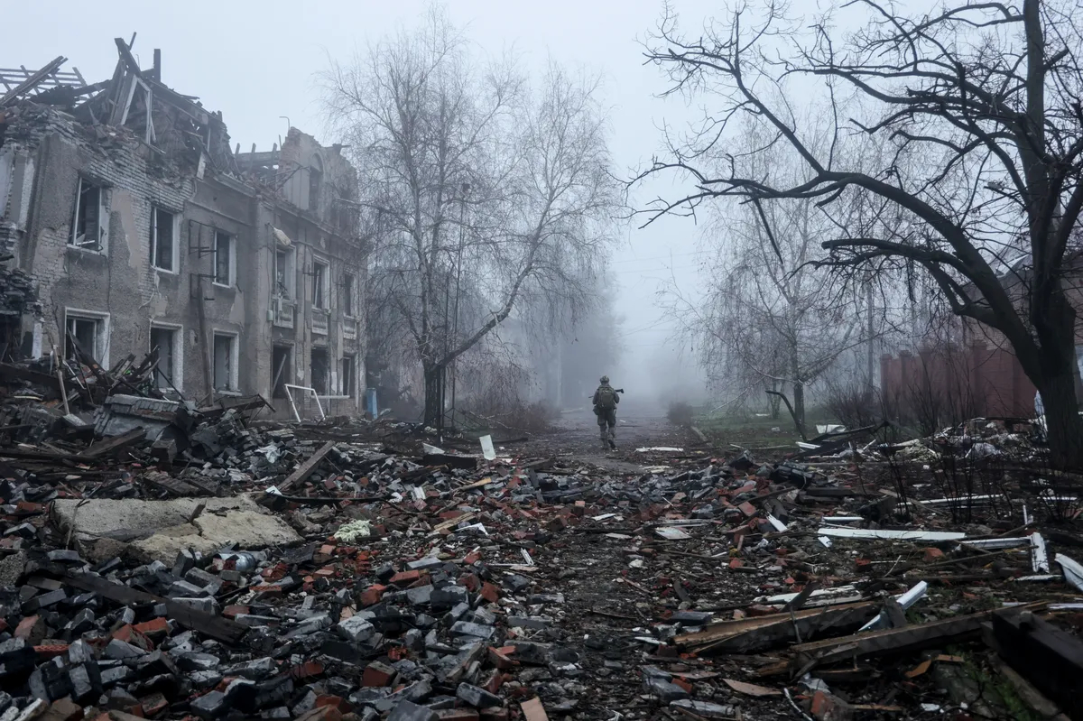 A Ukrainian serviceman walks through the ruins of the Donetsk region city of Kostyantynivka in eastern Ukraine, 28 November 2025. Photo: EPA / AFU